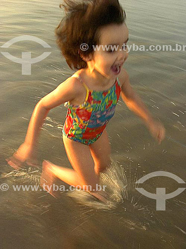  Child running at the beach 