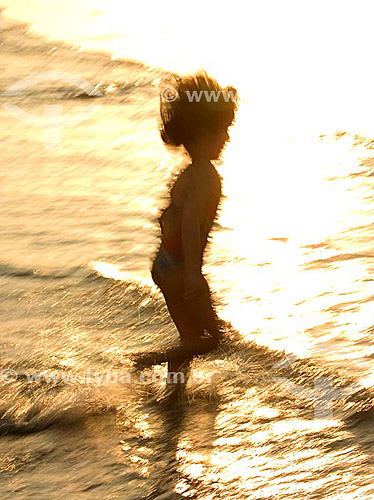  Child playing at the beach 