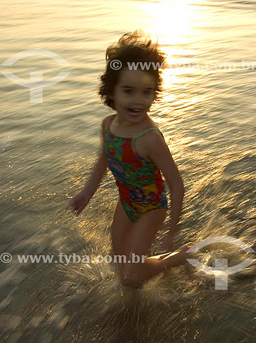  Child running at the beach 