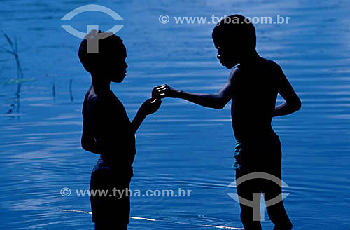  Silhouette of boys holding hands 