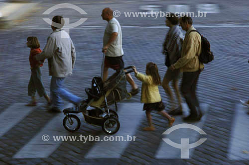  Pedestrians crossing the street - girl guiding a baby car 