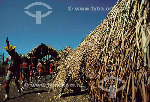  Indians dancing next to a 