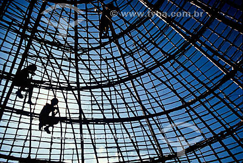  Silhouette of Indians building a 