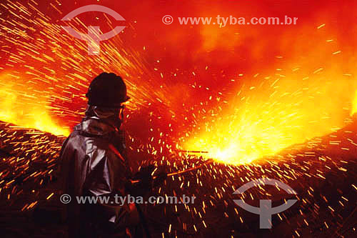  Worker operating blast furnace at CSN (National Siderurgic Company) - Volta Redonda - Rio de Janeiro state - Brazil 