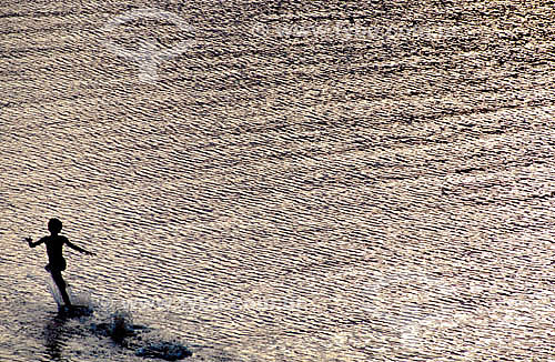  Boy running at the beach 