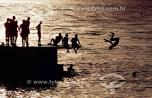  Boy over a pier playing of diving 