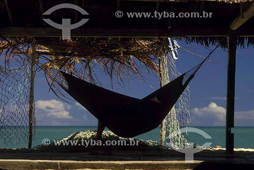  Tourist relaxing in a hammock on the beach - Corumbau neighbourhood - Bahia state - Brazil - 2004 