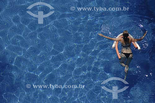  Woman  with a buoy at swimming pool - Melia Hotel - Maceio city - Alagoas state - Brazil - March 2006 