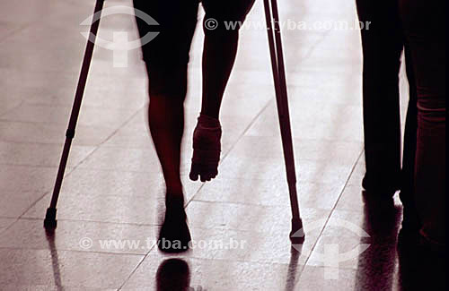  Physical disability - Person walking with crutches 