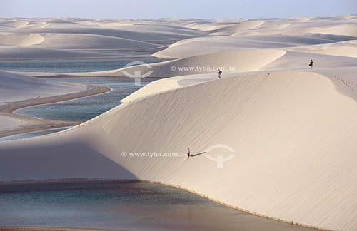 People climbing sand dunes in the Lençois Maranhenses National Park - Maranhao state - Brazil 