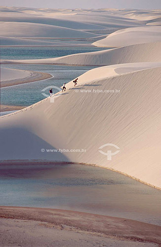  People climbing sand dunes in the Lençois Maranhenses National Park - Maranhao state - Brazil 