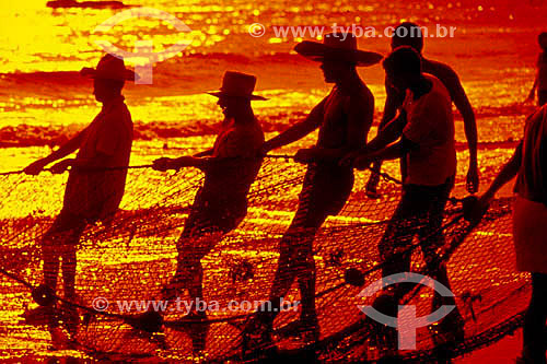  Silhouette of fishermen at sunset 