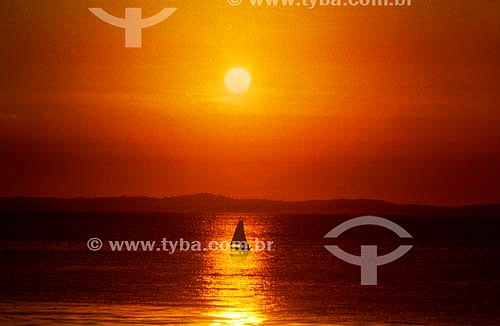  Sunset with a boat at the sea 