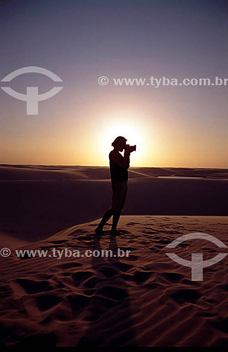  Photographer taking pictures in Lençois Maranhenses National Park - Maranhao state - Brazil 