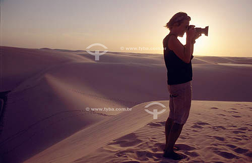  Photographer taking pictures in Lençois Maranhenses National Park - Maranhao state - Brazil 