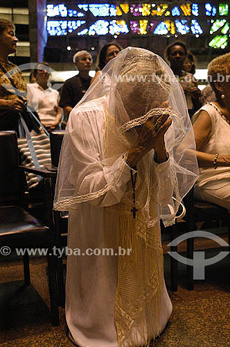  Woman praying at a mess in name of Pope John Paul II at Rio de Janeiro Cathedral - Rio de Janeiro state - Brazil 