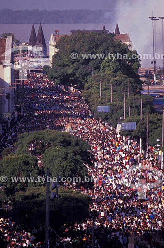  View of the Cirio de Nazare (religious celebration) Procession with the Ver o Peso Market (See the Weight Market) (*) in the background - Belem city - Para state - Brazil (*) Founded in 1688, is the main touristic atraction in Belem city;  it is a N 