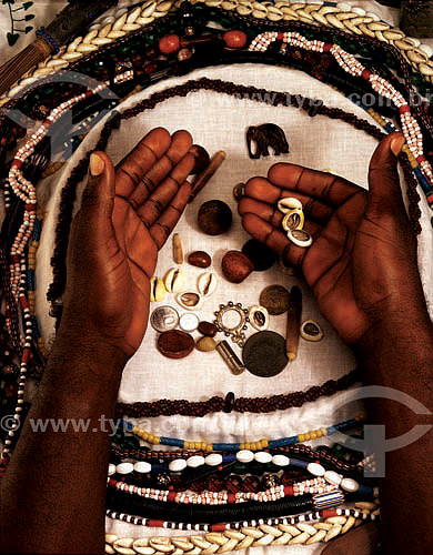  Detail of hands playing buzios - Umbanda and Camdomblé (afro-brazilian religions) 