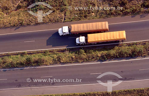  Aerial view of trucks driving along a road - South of Brazil 
