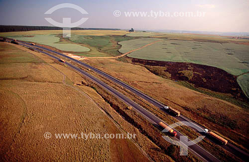  Aerial view of trucks moving along a highway in south of Bahia state - Brazil 
