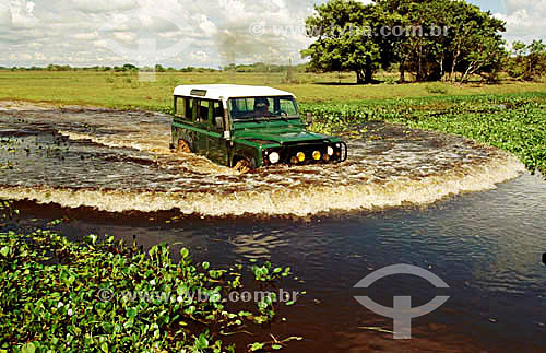  Car - Jeep passing through a flooded road at Pantanal   