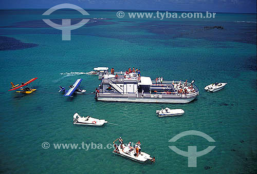  Boats and ultralights anchored at a beach in northeast of Brazil 