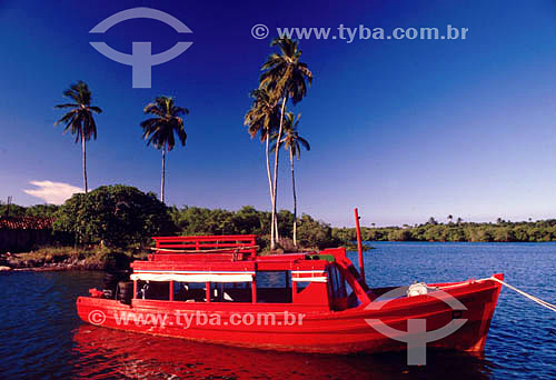  Red tour boat - Caixa Prego in Itaparica`s Island* - Bahia state - Brazil  * The Itaparica`s Island is situated in the Baia de Todos os Santos (Todos Os Santos Bay) and its architectural and town planning joint is a National Historic Site since 28-0 