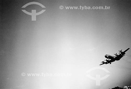  The Lockheed Electra airplane flying, symbol of the flight path from Rio de Janeiro to Sao Paulo during decades, until December 1991. Santos Dumnont Airport - Rio de Janeiro - Brasil  