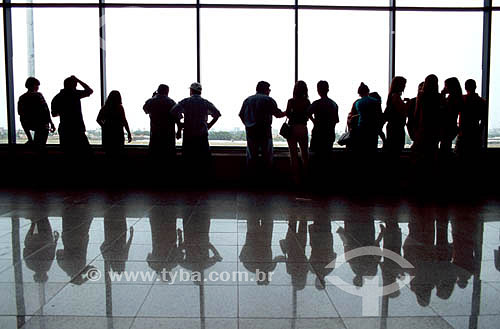  Silhouette of people in an airport 