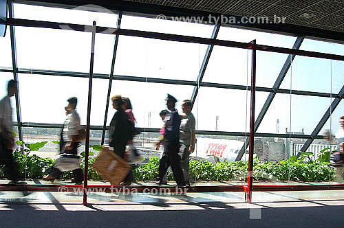  Passangers walking at an Airport lobby  - Aviation 