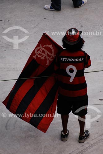 Subject: Flamengo soccer team fan holding flag 