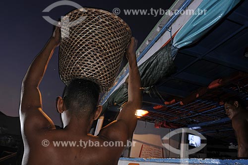  Subject: Man carrying acai - Ver-o-peso Market (See the Weight Market) / Place: Belem City - Para State - Brazil / Date: 10/13/2008 
