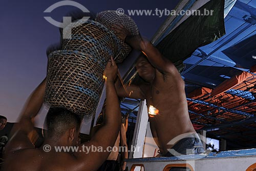  Subject: Man carrying acai - Ver-o-peso Market (See the Weight Market) / Place: Belem City - Para State - Brazil / Date: 10/13/2008 