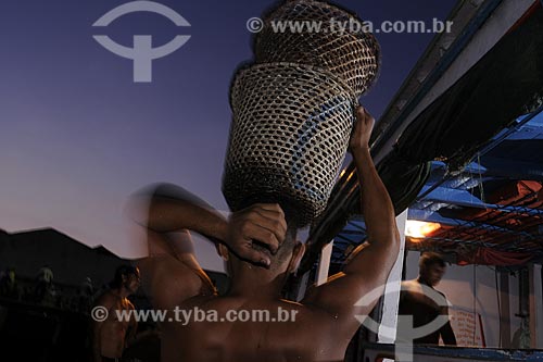  Subject: Man carrying acai - Ver-o-peso Market (See the Weight Market) / Place: Belem City - Para State - Brazil / Date: 10/13/2008 