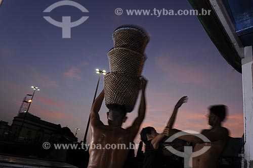  Subject: Man carrying acai - Ver-o-peso Market (See the Weight Market) / Place: Belem City - Para State - Brazil / Date: 10/13/2008 