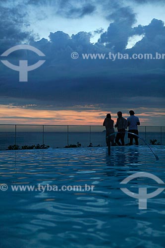  Subject:  Silhouette of people enjoying the sunset on the top floor of Fasano Hotel at Ipanema Beach - swimming pool in the foreground  / Place:  Rio de Janeiro City - Rio de Janeiro State - Brazil  / Date: 24/02/2010 