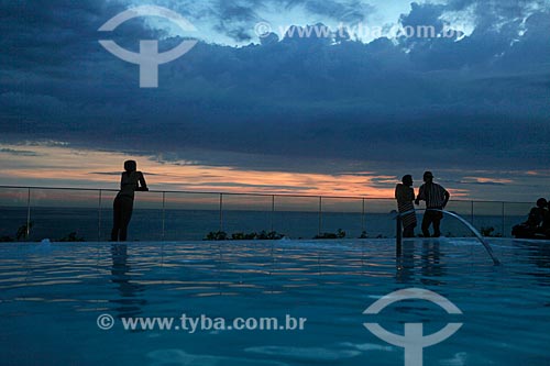  Subject:  Silhouette of people enjoying the sunset on the top floor of Fasano Hotel at Ipanema Beach - swimming pool in the foreground  / Place:  Rio de Janeiro City - Rio de Janeiro State - Brazil  / Date: 24/02/2010 