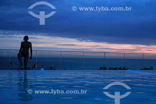  Subject:  Silhouette of people enjoying the sunset on the top floor of Fasano Hotel at Ipanema beach - swimming pool in the foreground  / Place:  Rio de Janeiro City - Rio de Janeiro State - Brazil  / Date: 24/02/2010 