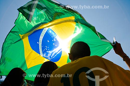  Subject: Brazilian soccer fans holding Brazilian flag during soccer match of FIFA World Cup 2010. / Place: Sao Paulo city - Sao Paulo state - Brazil / Date: 07/2010 