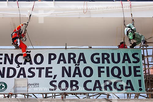  Reform Journalist Mario Filho Stadium - also known as Maracana - worker fixes the warning sign on the hoisting cables that will support the roof of the stadium   - Rio de Janeiro city - Rio de Janeiro state (RJ) - Brazil