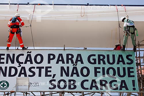  Reform Journalist Mario Filho Stadium - also known as Maracana - worker fixes the warning sign on the hoisting cables that will support the roof of the stadium   - Rio de Janeiro city - Rio de Janeiro state (RJ) - Brazil