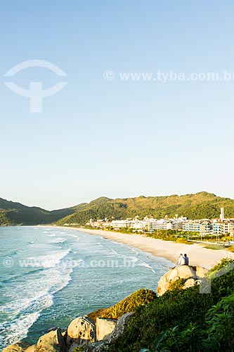  Subject: Two men admiring the landscape on the rock from Brava Beach / Place: Florianopolis city - Santa Catarina state (SC) - Brazil / Date: 06/2013 