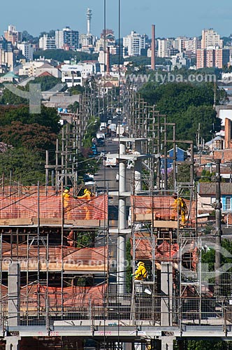  Subject: Workers at construction of Gremio Arena (2012) with the buildings in the background / Place: Humaita neighborhood - Porto Alegre city - Rio Grande do Sul state (RS) - Brazil / Date: 03/2012 