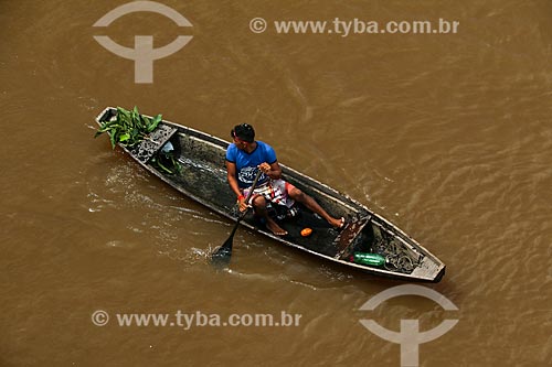  Man in canoe on the Amazon River  - Parintins city - Amazonas state (AM) - Brazil