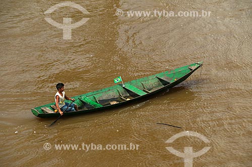  Man in canoe on the Amazon River  - Parintins city - Amazonas state (AM) - Brazil