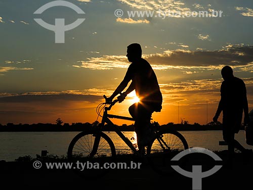  Cyclist on the banks of Guaiba Lake during sunset  - Porto Alegre city - Rio Grande do Sul state (RS) - Brazil