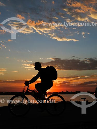  Cyclist on the banks of Guaiba Lake during sunset  - Porto Alegre city - Rio Grande do Sul state (RS) - Brazil