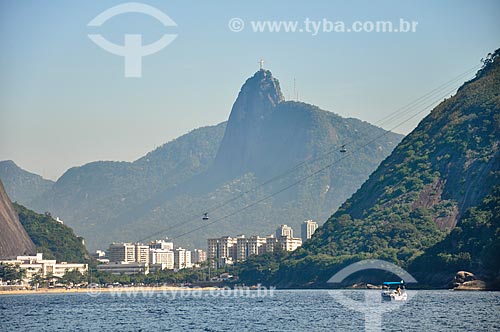  View of cable car making the crossing between the Urca Mountain and Sugar Loaf viewed from Guanabara Bay with the Christ the Redeemer (1931) in the background  - Rio de Janeiro city - Rio de Janeiro state (RJ) - Brazil