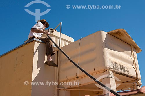  Man fueling the water tank during the water supply crisis  - Tambau city - Sao Paulo state (SP) - Brazil