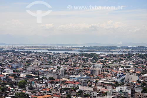  View of houses with the Antonio Carlos Jobim International Airport in the background from gondola of the Alemao Cable Car  - Rio de Janeiro city - Rio de Janeiro state (RJ) - Brazil